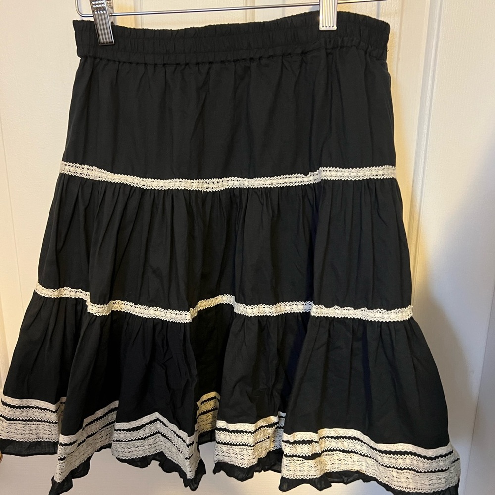 Lady’s Black with lace bordering skirt